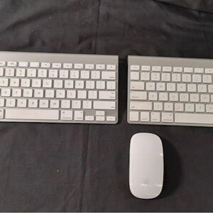 Two Sleek white Wireless Keyboards and 1 mouse apple brand. Used.